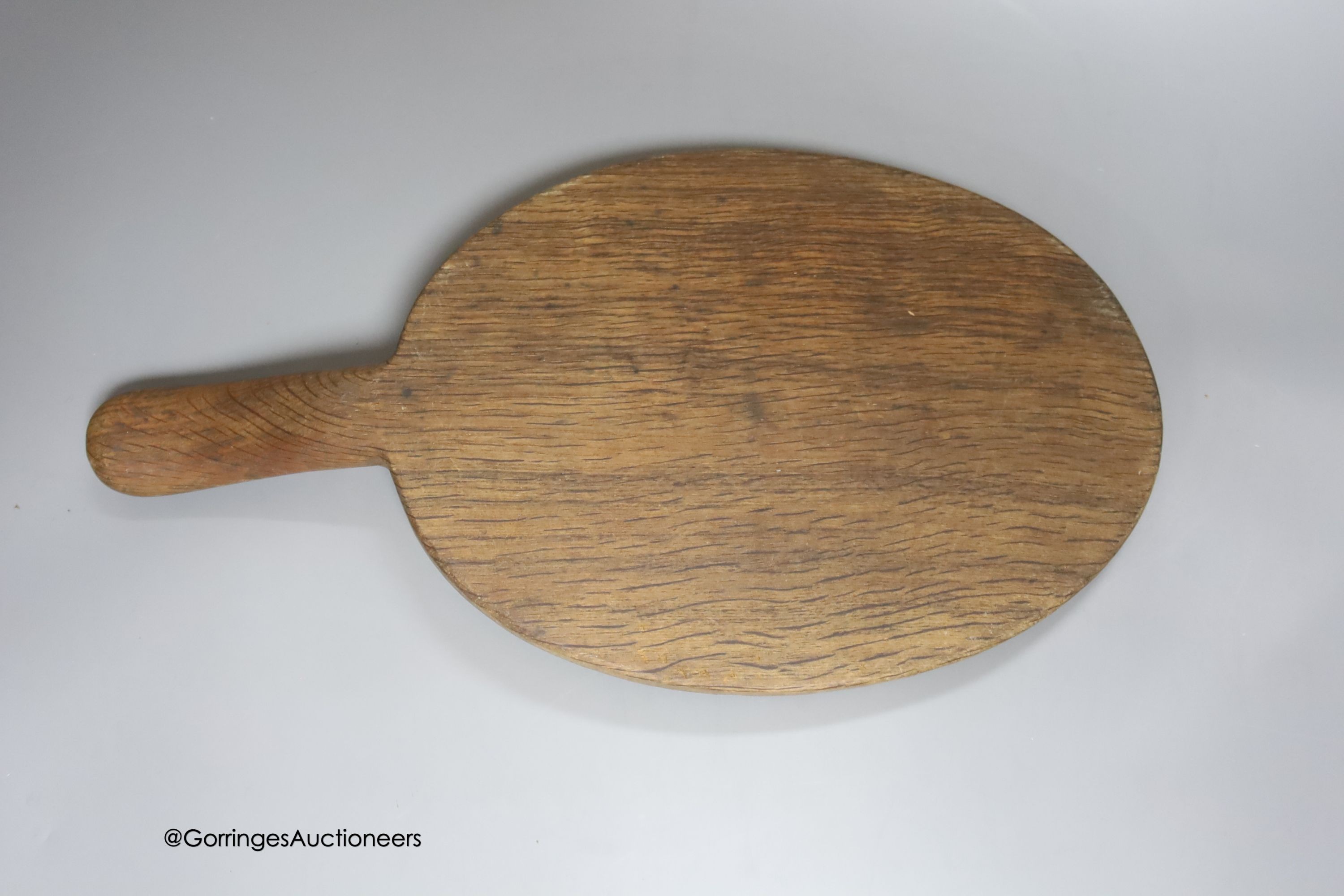 A Mouseman cheeseboard, length 38cm